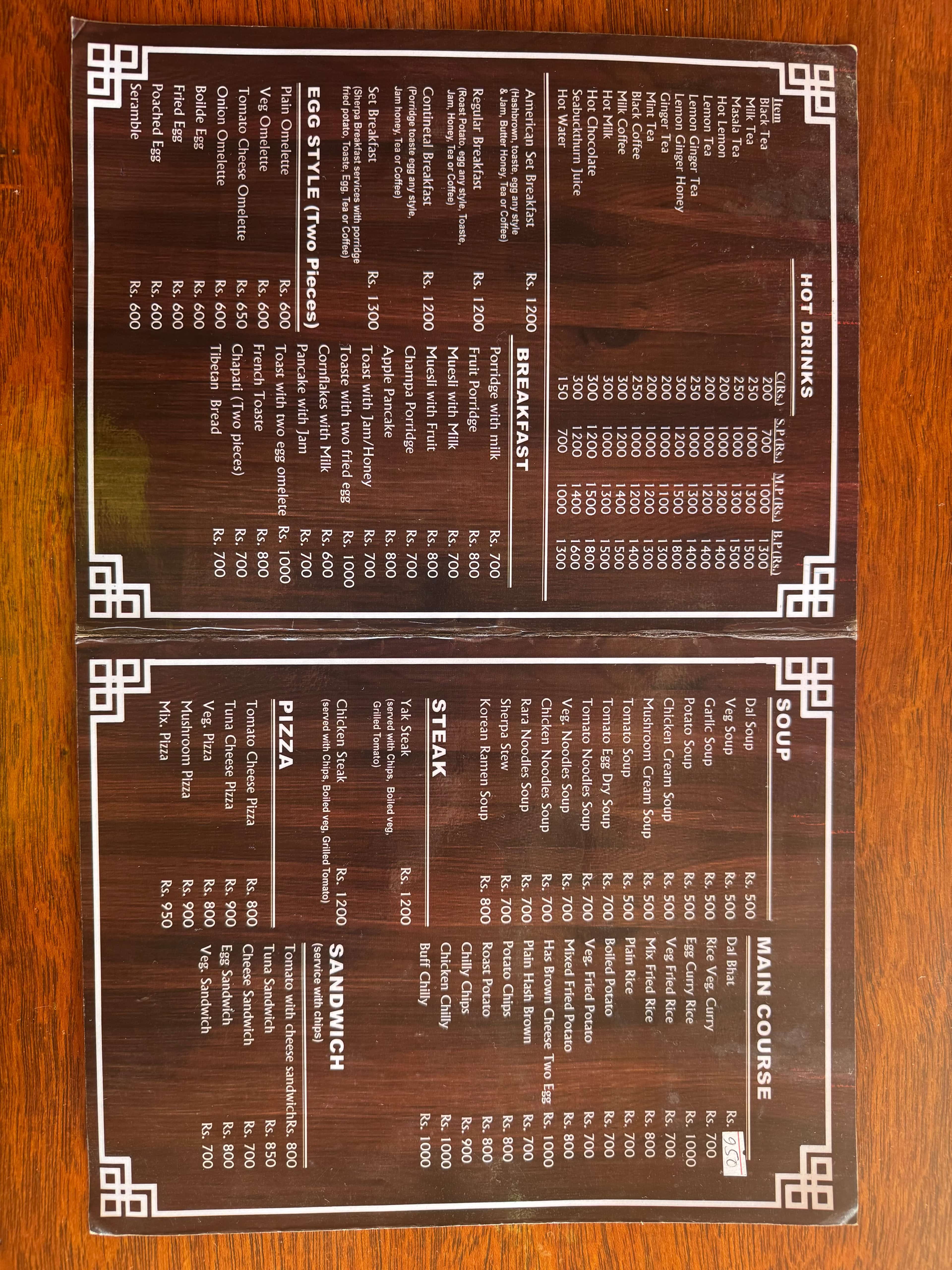 Menu page with breakfast, hot drinks, and main courses